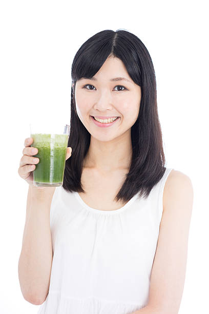 istock Woman drinking a smoothie 612496698