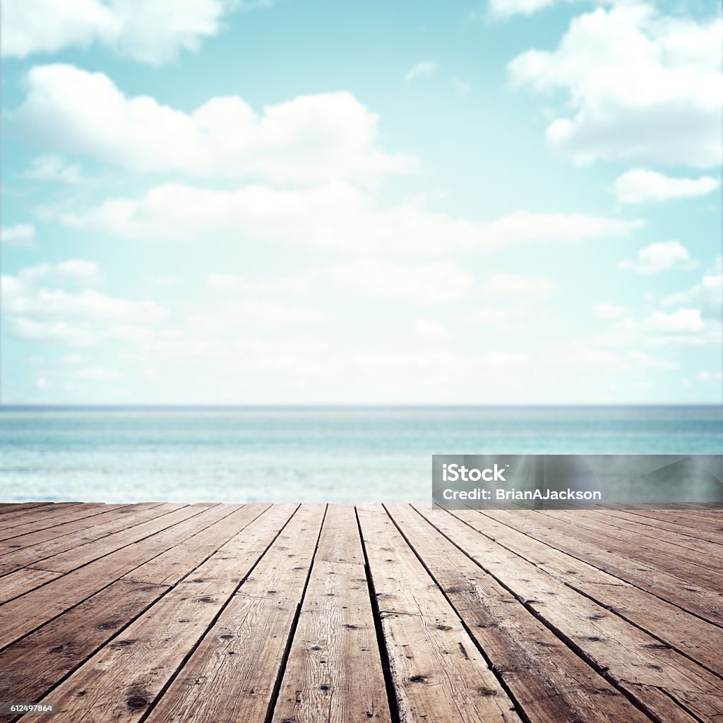 Summer vacation background Summer vacation background wooden plank boardwalk with sea and blue sky copy space Beach Stock Photo