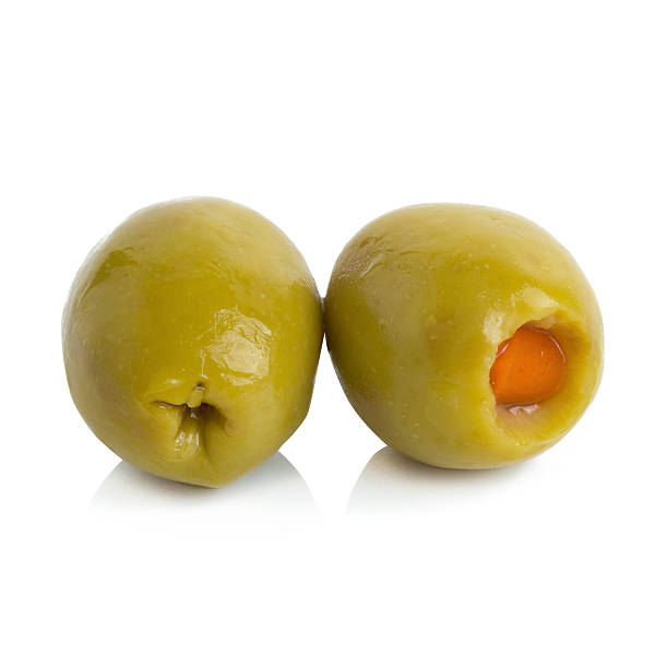 istock Green olives stuffed with red paprika isolated on white 612498032