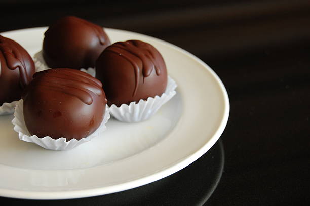 istock Healthy chocolate truffles with nuts and dates 612498880
