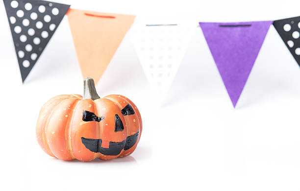 istock Pumpkin with halloween phrases on white background 612500564