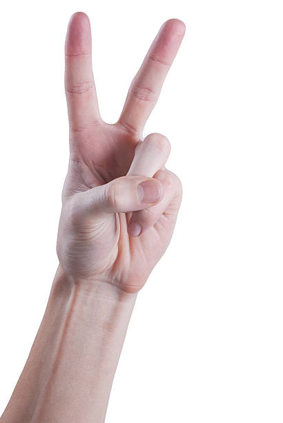 Hand gesturing peace symbol stock photo