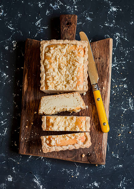 istock Ricotta orange tart on a rustic cutting board 612503676