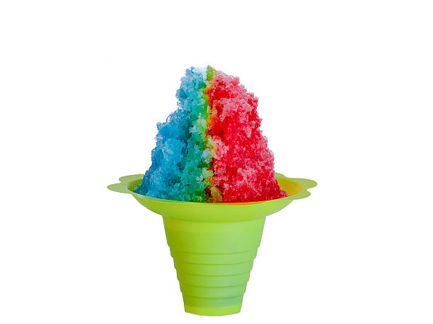 Rainbow shaved ice in a yellow flower cone cup. stock photo