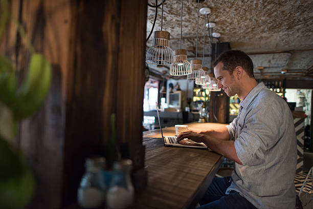 istock Man working online at the restaurant 612505206