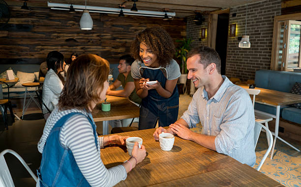 istock Happy waitress taking order at a restaurant 612505452