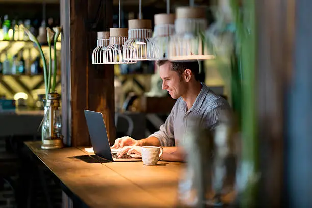 Photo of Business man working at a cafe