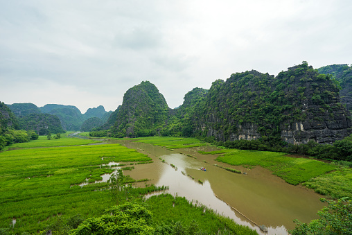 Trang An, Tam Coc, Ninh Binh, Viet nam. It's is UNESCO World Heritage Site, renowned for its boat cave tours. It's Halong Bay on land of Vietnam