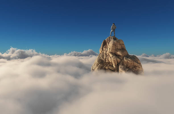 Man standing on a stone cliff A man standing on a stone cliff over the clouds .Success concept. This is a 3d render illustration mountain peak stock pictures, royalty-free photos & images