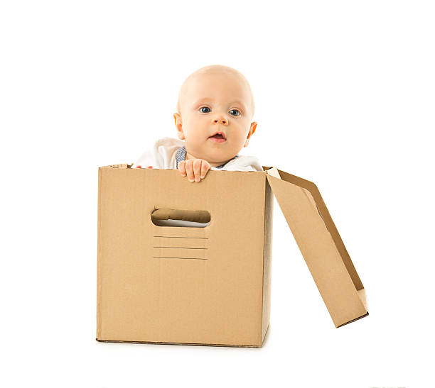 istock small baby in box isolated on white 612507760