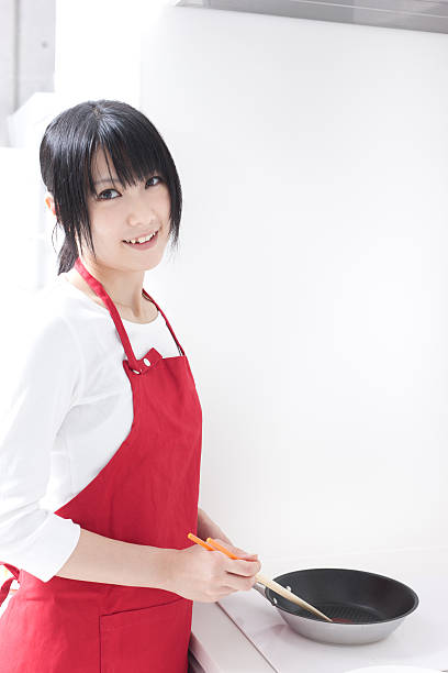 istock Japanese woman wearing an apron 612508280