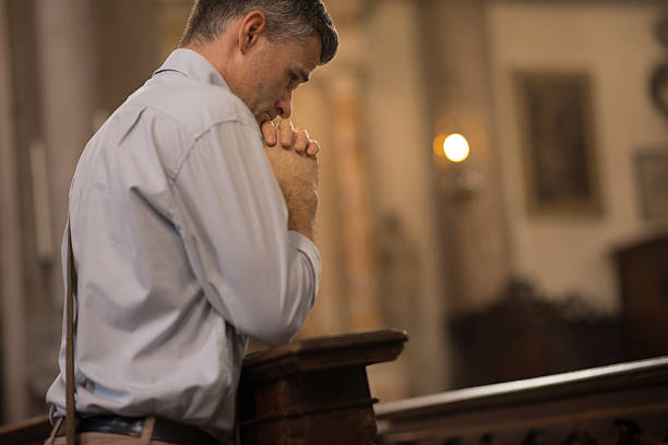 istock Religious man in the Church 612508528