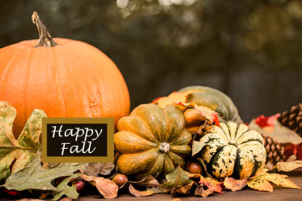 istock Happy Fall!  Autumn centerpiece with pumpkin, leaf decorations. 612509068