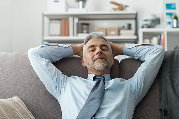 istock Businessman resting on the sofa 612510982