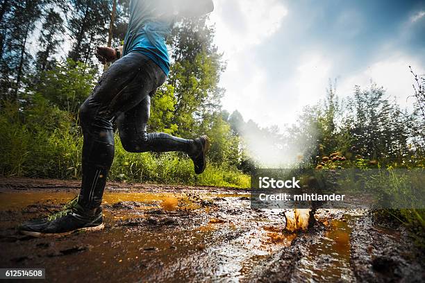 Runner Stock Photo - Download Image Now - Mud, Running, Cross-Country Running