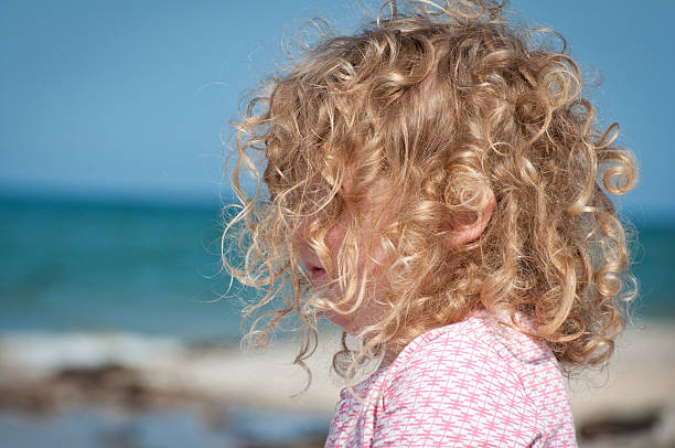 istock Child looking out to the sea 612516226