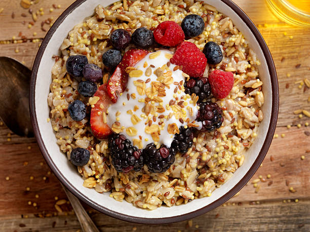 istock Hot 7 Grain Breakfast Cereal With Yogurt and Fresh Fruit 612516686