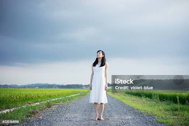 Woman Standing In A Rice Paddy Stock Photo - Download Image Now - Women, Only Women, Dress