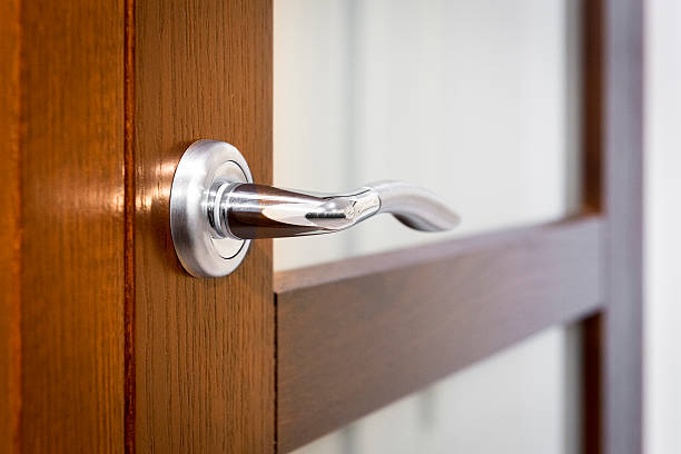 istock Part of open door with silver door-handle 612517204