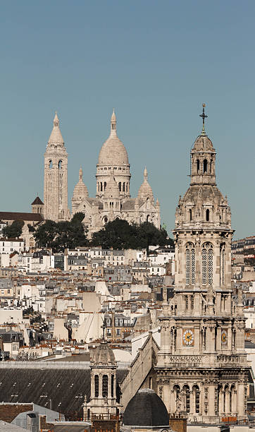 istock The basilica Sacre Coeur and Saint Trinity church, Paris . 612520012