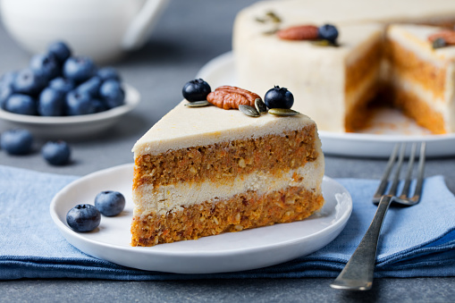 Vegan, raw carrot cake. Healthy food. Grey stone background Top view Copy space. Selective focus.