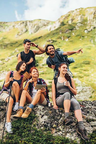 istock Friends browsing the net in the mountain 612521630