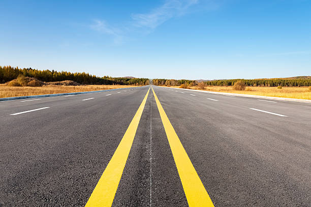 istock long road in autumn 612522894