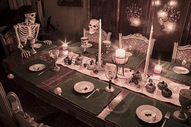 istock Halloween Skeleton Family Celebrating a Holiday Dinner 612524610