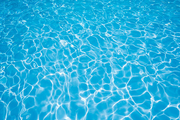 istock Beautiful blue water surface in swimming pool 612524996