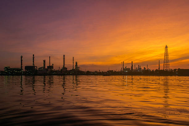 istock Oil refinery along the river at Dusk (Bangkok, Thailand) 612615734