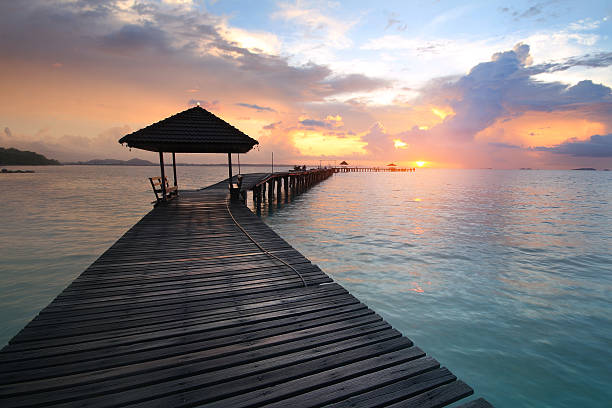 istock wood bridge during time the sunrise 612616088