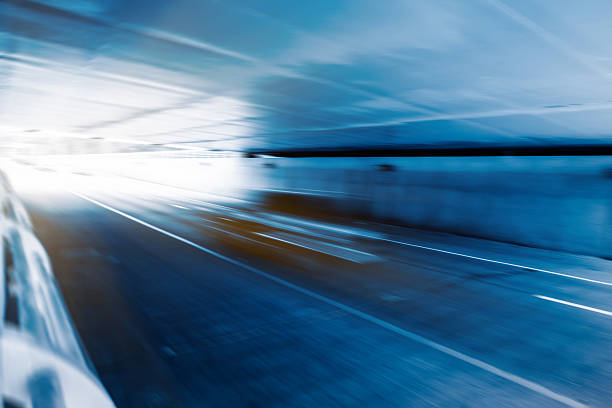 istock City road with moving car 612616924