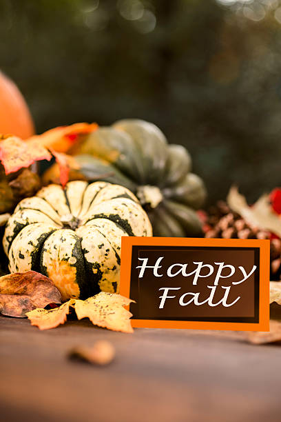 istock Happy Fall!  Autumn centerpiece with pumpkin, leaf decorations. 612617020