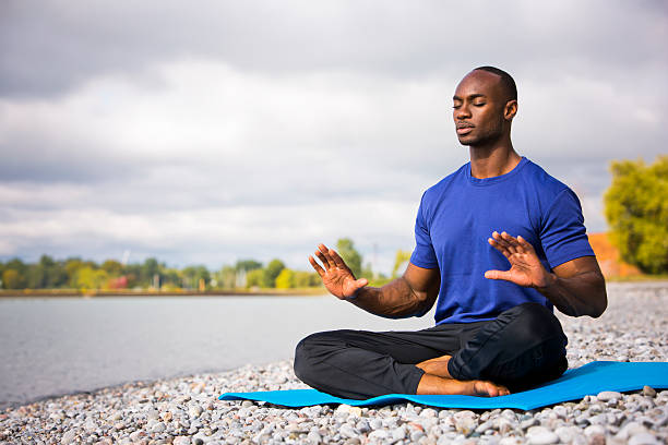 istock young man exercising yoga 612617866