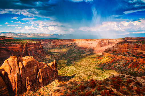 Summer rain storm and rainbow passes over Colorado National Monument