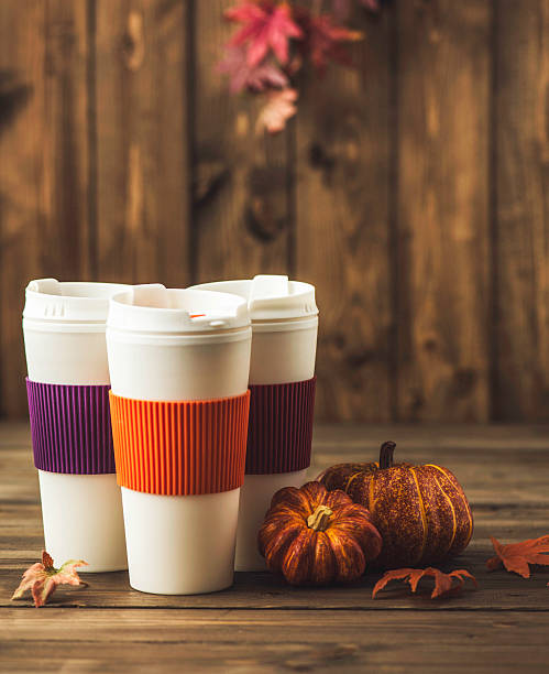istock Reusable coffee cups with pumpkins and leaves. Fall arrangement 612623142