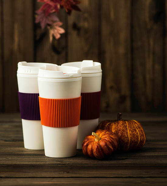 istock Reusable coffee cups with pumpkins and leaves. Fall arrangement 612623490