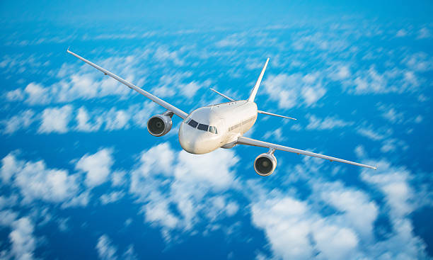 istock Commercial jet plane flying above clouds 612623976