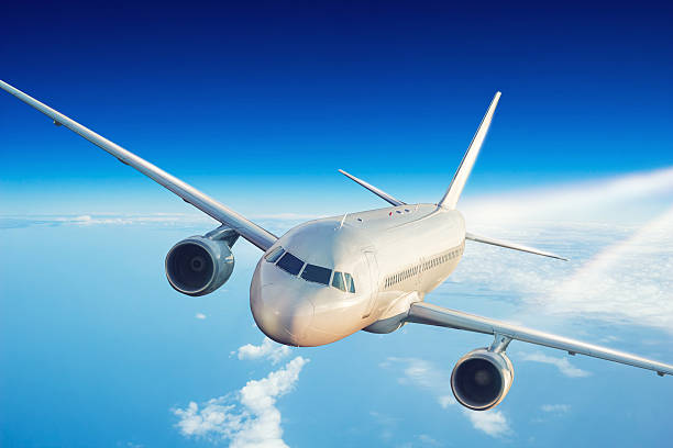 istock Commercial jet plane flying above clouds 612623994