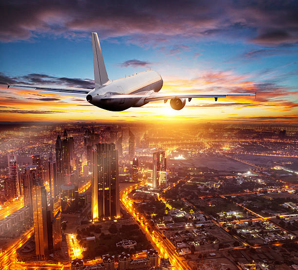 istock Commercial airplane flying over Dubai city 612624082