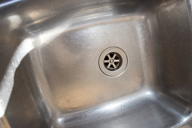 istock Stainless steel drain in kitchen sink 612625228