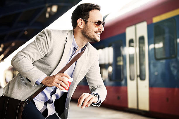 istock Businessman on railroad station 612626174
