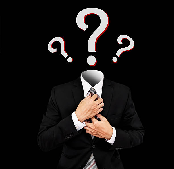 istock Businessman with question marks symbol instead of head 612627022