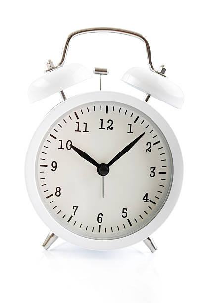 istock White alarm clock shows 7 after 10 612629632