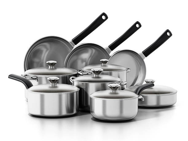 Stainless steel cooking and frying pans set isolated on white.