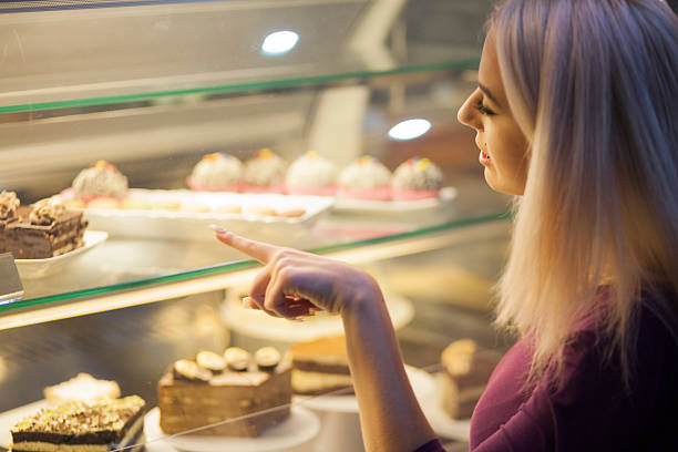 istock Choosing sweets in a coffee shop 612630916