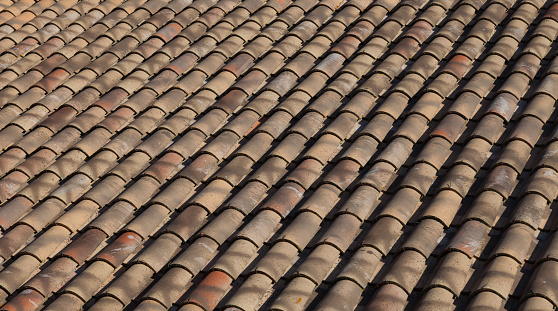 Typical Spanish roof covered in S style terracotta clay roof tiles