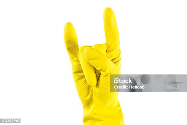 Womans Hand In Yellow Rubber Gloves Shows Horns Up Stock Photo - Download Image Now