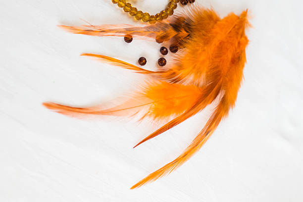 istock Beautiful colored glass and thread beads, feathers 612632988