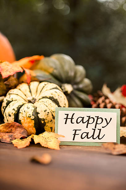 istock Happy Fall!  Autumn centerpiece with pumpkin, leaf decorations. 612633462